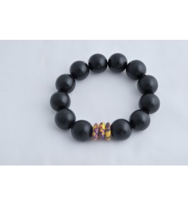 Adzo Designs black wood beads with a multicolour krobo ghanian bead on stretch